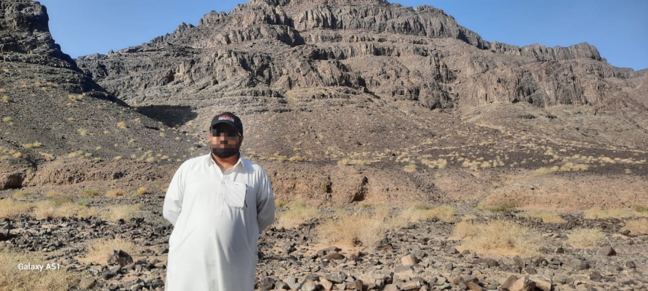 The immense scale of a copper mine in Chile, with roads winding down the massive open pit to the mining area.